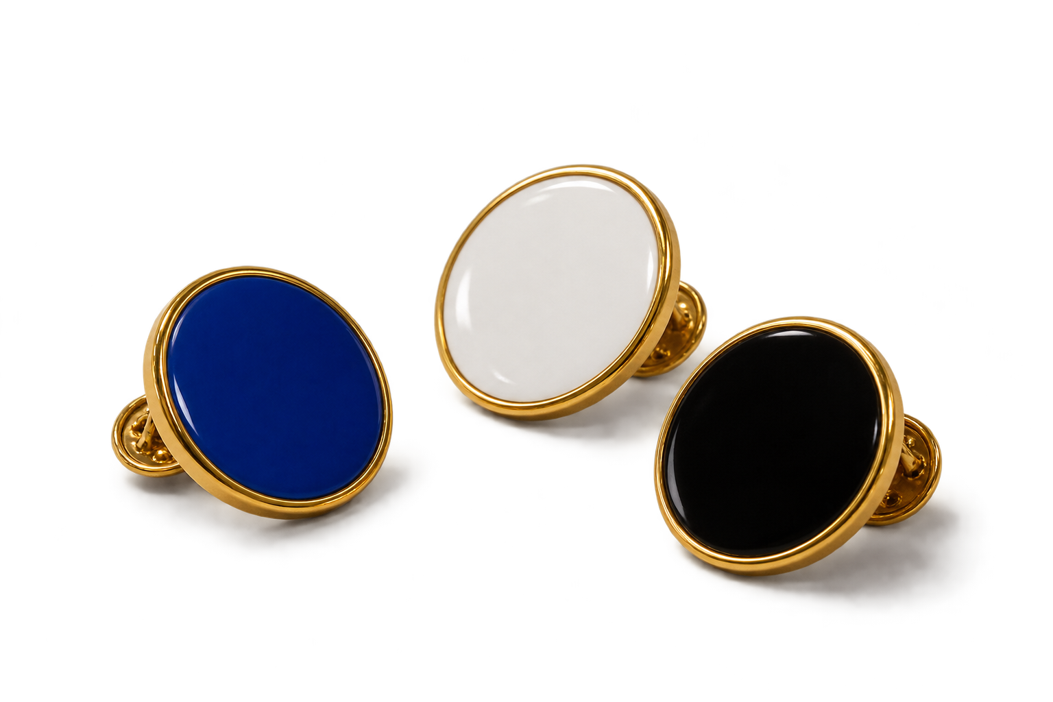Tres pins circulars esmaltats de TROS: blau, blanc i negre